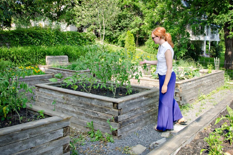 Sarah in Almonte Riverside Boutique Inn garden - by Amy Eaton